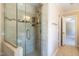 Custom tile shower with glass doors and built in shelf at 5812 N Beaver Ln, Raleigh, NC 27604