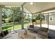 Relaxing sun room with large windows offering picturesque views of the backyard at 5812 N Beaver Ln, Raleigh, NC 27604