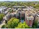 Stunning aerial view of the building showcasing its pool, surrounding greenery, and urban location at 618 N Boylan Ave # 810, Raleigh, NC 27603