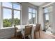 Dining area with natural lighting from a large window and access to a balcony at 618 N Boylan Ave # 810, Raleigh, NC 27603