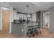 Modern kitchen features a breakfast bar with granite countertop and stainless steel appliances at 618 N Boylan Ave # 810, Raleigh, NC 27603