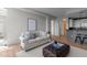 Open concept living room with hardwood floors and view to kitchen at 618 N Boylan Ave # 810, Raleigh, NC 27603