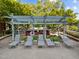 Relaxing pool deck area features lounge chairs and a pergola, ideal for sunny days and entertaining at 618 N Boylan Ave # 810, Raleigh, NC 27603
