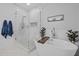 Bright bathroom features a modern freestanding tub and a glass-enclosed shower at 6200 Oliver Creek Pkwy, Holly Springs, NC 27540