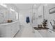Elegant bathroom featuring a double vanity, walk-in shower, and luxurious soaking tub at 6200 Oliver Creek Pkwy, Holly Springs, NC 27540