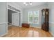 Formal dining room with large windows, hardwood floors, and elegant architectural details at 6200 Oliver Creek Pkwy, Holly Springs, NC 27540