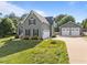 Charming two-story home with a spacious two-car garage and well-maintained lawn at 6200 Oliver Creek Pkwy, Holly Springs, NC 27540
