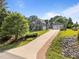 Beautiful home exterior with a long driveway and a three-car garage, offering ample parking and curb appeal at 6200 Oliver Creek Pkwy, Holly Springs, NC 27540