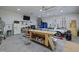 Spacious garage with workspace, car, and ample storage and lighting at 6200 Oliver Creek Pkwy, Holly Springs, NC 27540