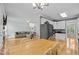 Inviting living room and kitchen area with hardwood floors and modern amenities create a cozy atmosphere at 6200 Oliver Creek Pkwy, Holly Springs, NC 27540