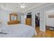Well-appointed main bedroom with hardwood floors, ample closet space, and a calming color palette at 6200 Oliver Creek Pkwy, Holly Springs, NC 27540