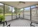 Inviting screened porch with comfortable seating and views of the lush, green backyard at 6200 Oliver Creek Pkwy, Holly Springs, NC 27540