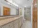 Bathroom featuring granite countertops, bright lights, and walk-in shower at 6420 Dresden Ln, Raleigh, NC 27612