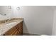 Bathroom with wooden vanity and granite countertop and a neutral color scheme at 6420 Dresden Ln, Raleigh, NC 27612