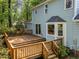Expansive wooden deck accessible from sliding glass doors offers an ideal outdoor entertaining space at 6420 Dresden Ln, Raleigh, NC 27612