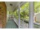 Relaxing screened-in porch with wooden floors and a view of the backyard at 6420 Dresden Ln, Raleigh, NC 27612