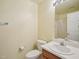 This bathroom features a white toilet and a sink with wood cabinets at 649 Flaherty Ave, Wake Forest, NC 27587