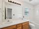 Bright bathroom with double sink vanity and a shower-tub combination at 649 Flaherty Ave, Wake Forest, NC 27587