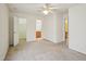 Carpeted bedroom with ceiling fan, a walk-in closet and an attached bathroom at 649 Flaherty Ave, Wake Forest, NC 27587