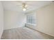Neutral carpeted bedroom with bright window allowing ample natural light at 649 Flaherty Ave, Wake Forest, NC 27587