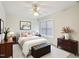 Comfortable bedroom with large window, ceiling fan and stylish decor at 649 Flaherty Ave, Wake Forest, NC 27587
