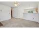 Spacious living room with neutral carpet and a view into the kitchen at 649 Flaherty Ave, Wake Forest, NC 27587