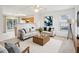 Bright living room with two sofas, wood coffee table, ceiling fan, and decor at 649 Flaherty Ave, Wake Forest, NC 27587