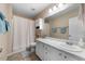 Another view of this bathroom, showing a clean, neutral space with good storage at 6612 Rossford Ln, Durham, NC 27713