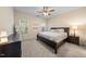 Comfortable bedroom with natural light and dark wood furniture at 6612 Rossford Ln, Durham, NC 27713