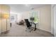 Spacious bonus room filled with light, furnished with a desk and sofa at 6612 Rossford Ln, Durham, NC 27713