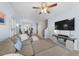 Bright living room with hardwood floors and a comfortable sectional sofa at 6612 Rossford Ln, Durham, NC 27713
