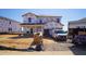New two-story home under construction featuring Tyvek HomeWrap and materials on site at 676 White Birch Ln, Angier, NC 27501