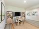 Cozy dining area featuring a table, chairs, bookshelves, a TV, and modern decor at 676 White Birch Ln, Angier, NC 27501
