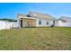Backyard with a white fence and a covered patio with seating at 6921 Peppermill Way, Rocky Mount, NC 27804