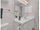 Bathroom with a white vanity and sink with white faucet. Mirror on wall above at 6921 Peppermill Way, Rocky Mount, NC 27804