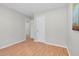 Bright empty bedroom featuring laminate floors, neutral paint, and bright natural lighting at 6921 Peppermill Way, Rocky Mount, NC 27804