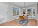 Breakfast nook with bright windows, wood-look flooring, and seating for two at 6921 Peppermill Way, Rocky Mount, NC 27804