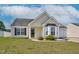 Charming single-story home featuring a bay window, manicured lawn, and attached one car garage at 6921 Peppermill Way, Rocky Mount, NC 27804