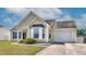 View of a charming single-story home with an attached one car garage and an established lawn at 6921 Peppermill Way, Rocky Mount, NC 27804
