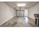 Spacious garage with neutral colors, ample lighting and an overhead door at 6921 Peppermill Way, Rocky Mount, NC 27804