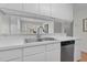 Close up of the kitchen featuring white cabinets, countertops, and stainless steel appliances at 6921 Peppermill Way, Rocky Mount, NC 27804