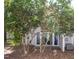 A backyard with mature trees and an AC unit at 7177 Sandy Creek Dr, Raleigh, NC 27615