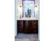 Bathroom featuring a vanity with a framed mirror and sconces at 7177 Sandy Creek Dr, Raleigh, NC 27615