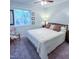 Comfortable bedroom with a well-lit interior, a cozy bed, and a window at 7177 Sandy Creek Dr, Raleigh, NC 27615