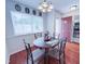 Cozy dining area featuring a round table with seating for four and bright natural light at 7177 Sandy Creek Dr, Raleigh, NC 27615