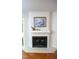 A white fireplace with a mantel and a painting above at 7177 Sandy Creek Dr, Raleigh, NC 27615