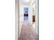 A carpeted hallway with doors leading to other rooms at 7177 Sandy Creek Dr, Raleigh, NC 27615