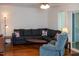 Cozy living room with a large sectional sofa and a recliner at 7177 Sandy Creek Dr, Raleigh, NC 27615