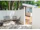 Enclosed patio area with white fencing and comfortable seating, creating a cozy outdoor space at 7177 Sandy Creek Dr, Raleigh, NC 27615