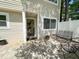 Private patio with stylish pavers and black metal furniture, perfect for outdoor relaxation at 7177 Sandy Creek Dr, Raleigh, NC 27615